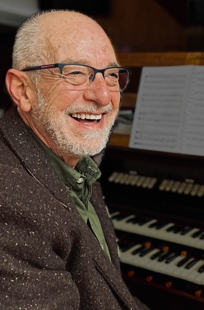 Philip Loots smiling at the organ console